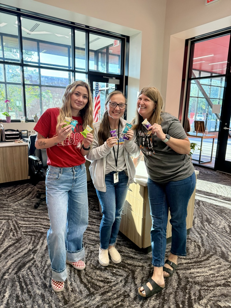 staff holding rice Krispy treats 