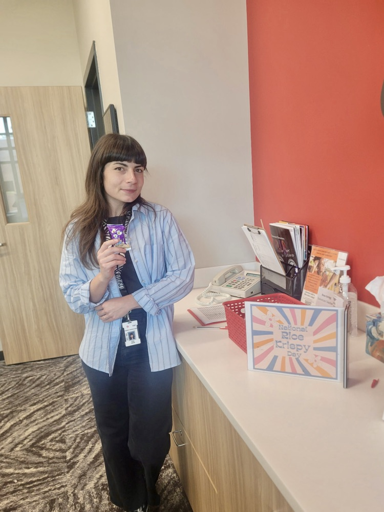 staff holding rice Krispy treats 