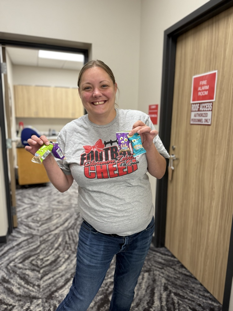 staff holding rice Krispy treats 