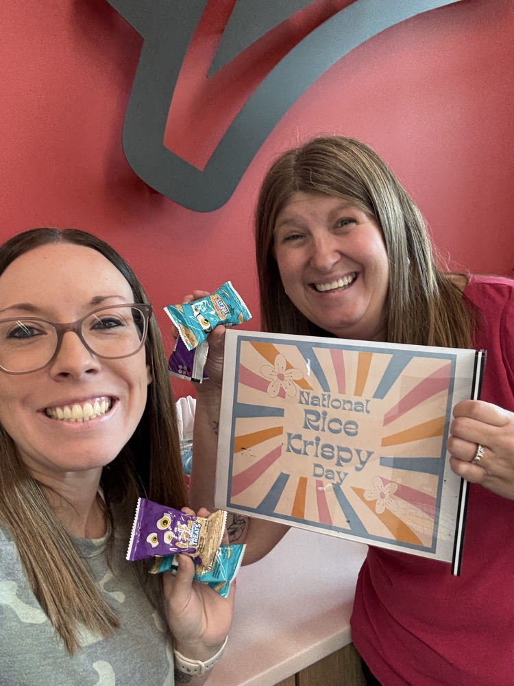 staff holding rice Krispy treats 