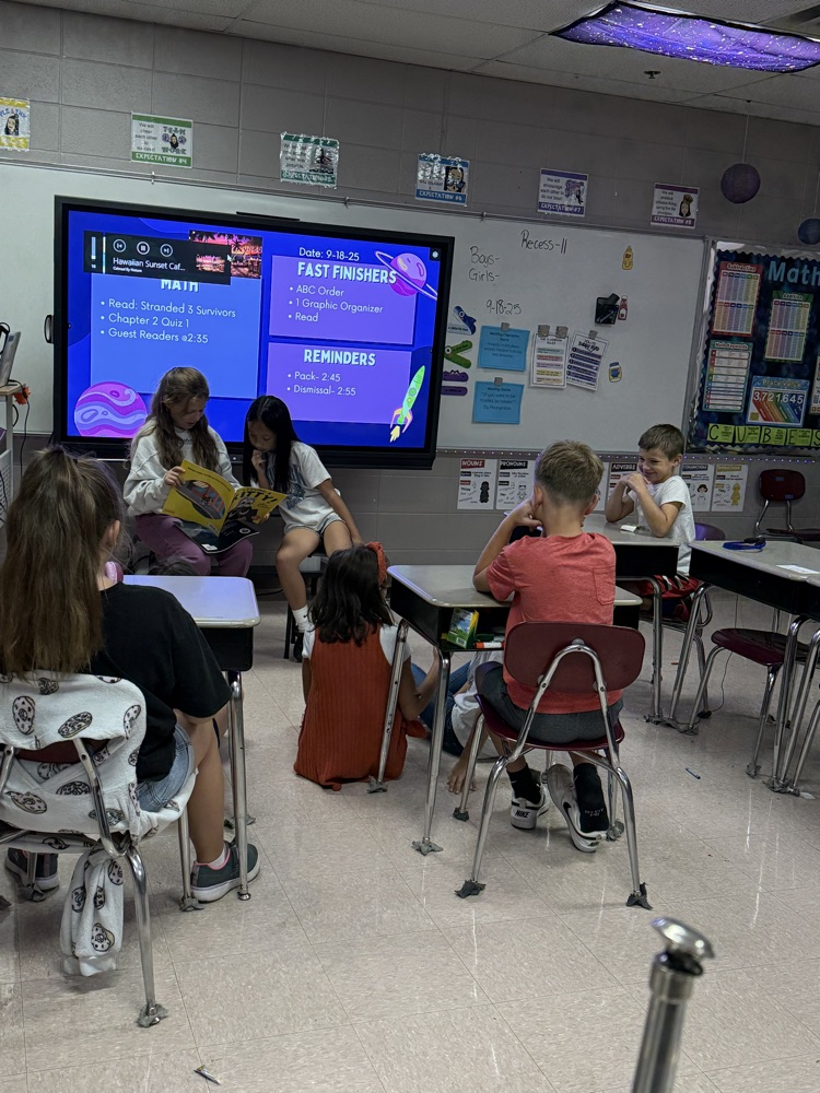 students listening to girls reading