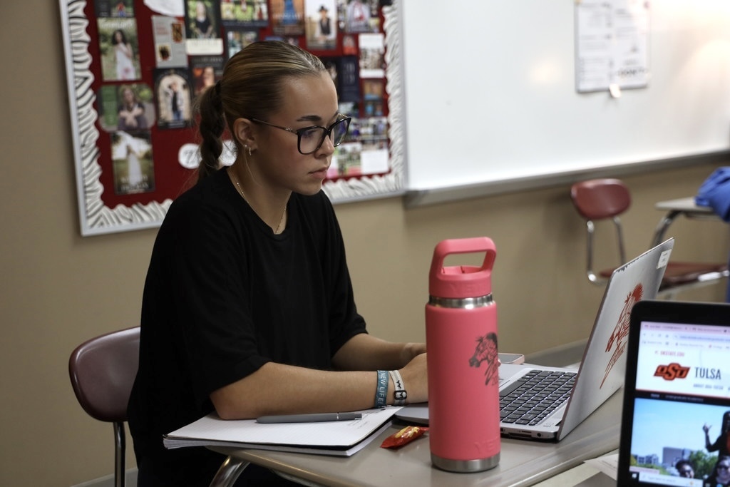 student filling out application on computer