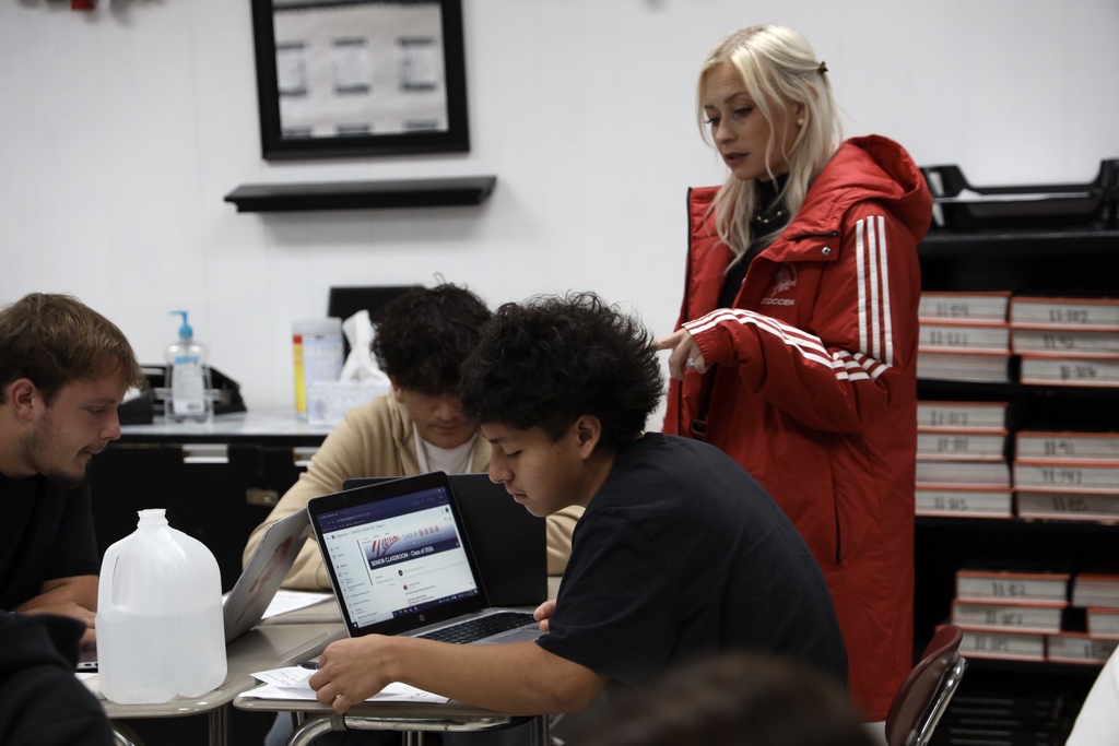 teacher helping student with application