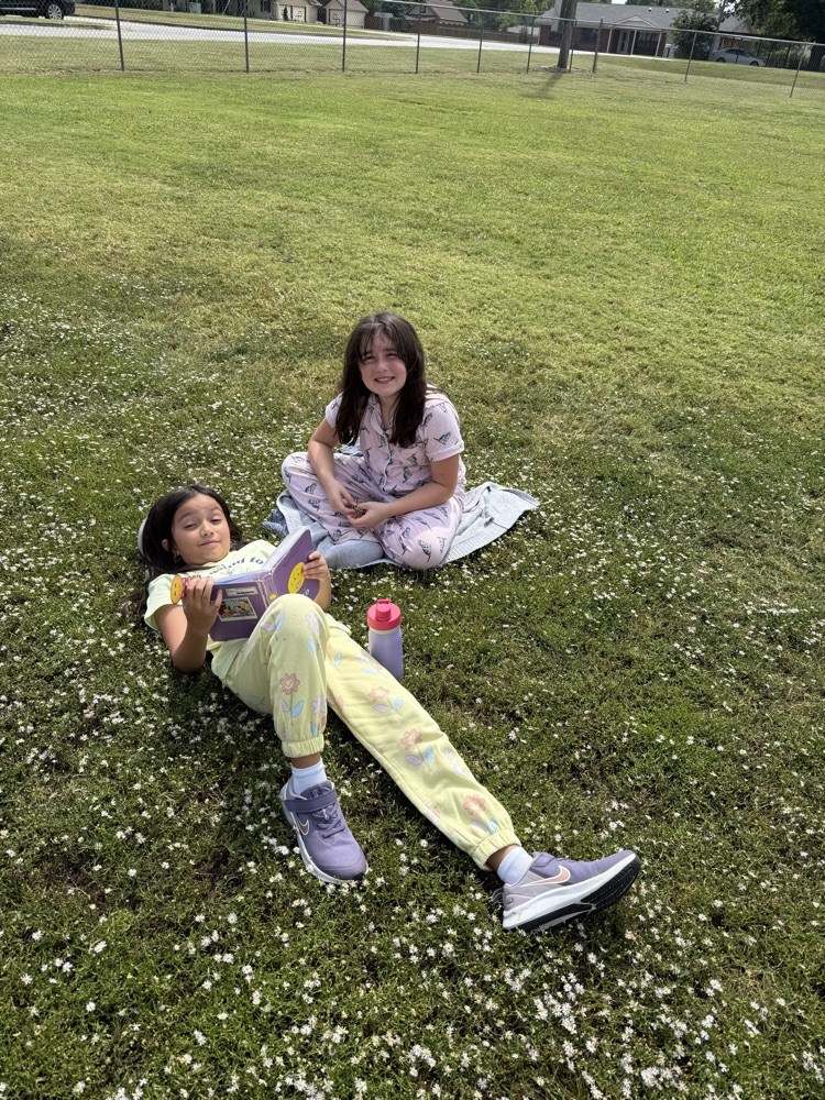 students reading at recess