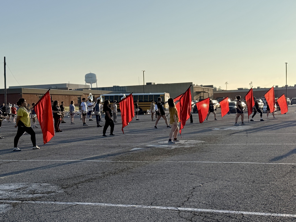 Red flags waving at marching practice 