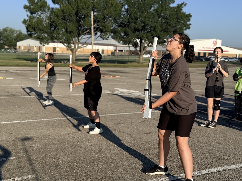 Color guard throwing rifles.