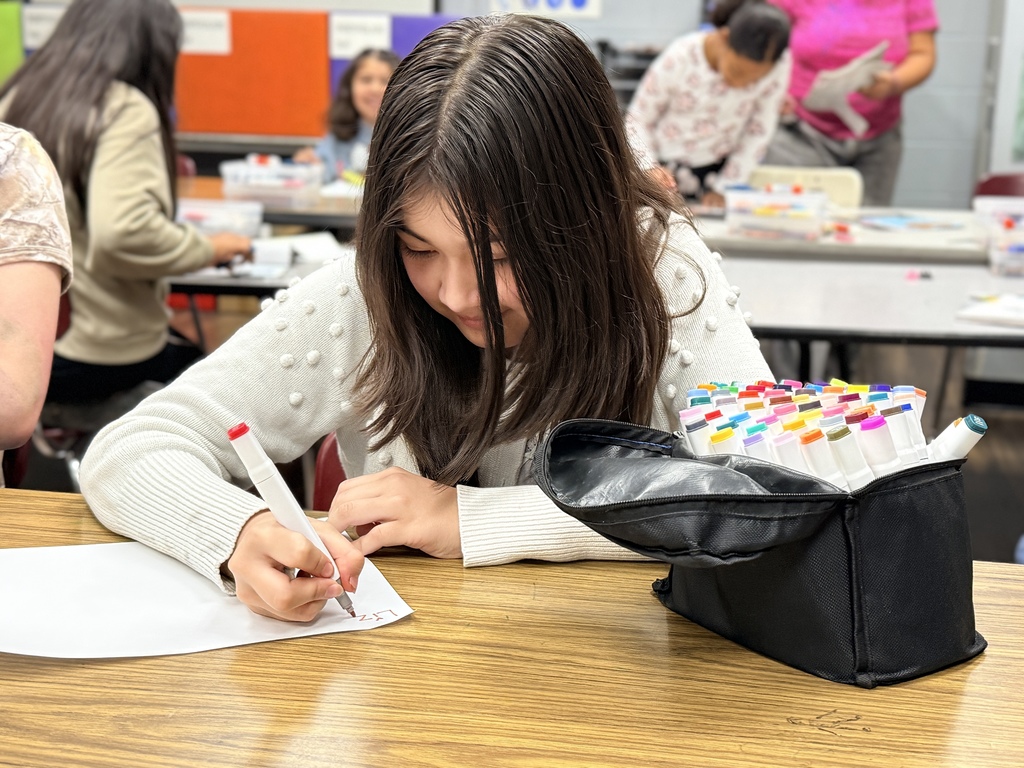 Student working on her art journal