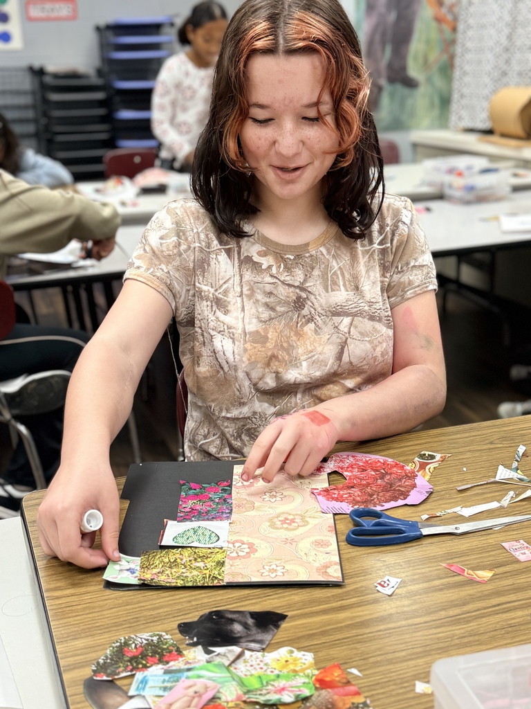 Student making sure the picture is in just the right spot
