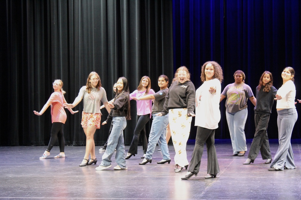 Students in sync working on their moves