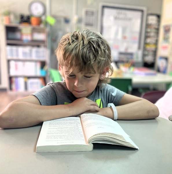 boy student reading book
