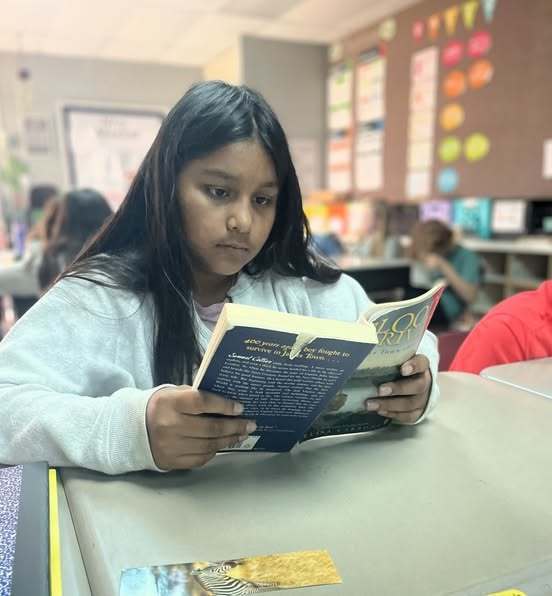 girl student reading book