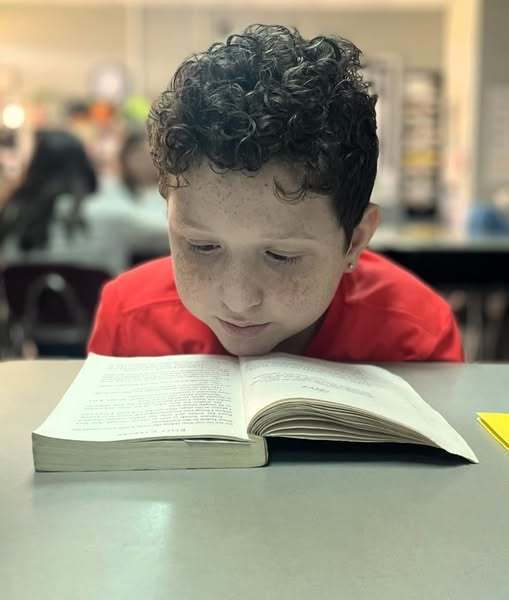 boy student reading book