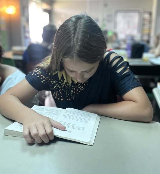 student reading book