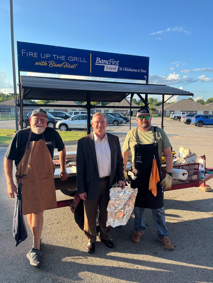Westside’s partners in education grilling hotdogs