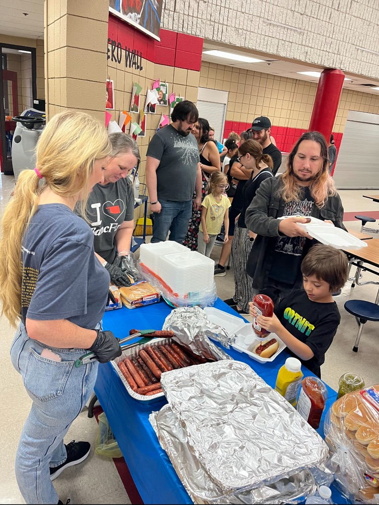 serving hotdogs