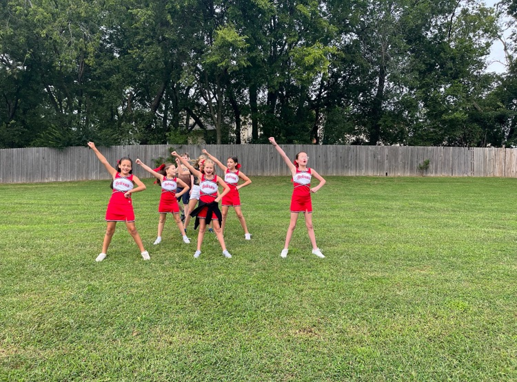 girls in cheer uniforms