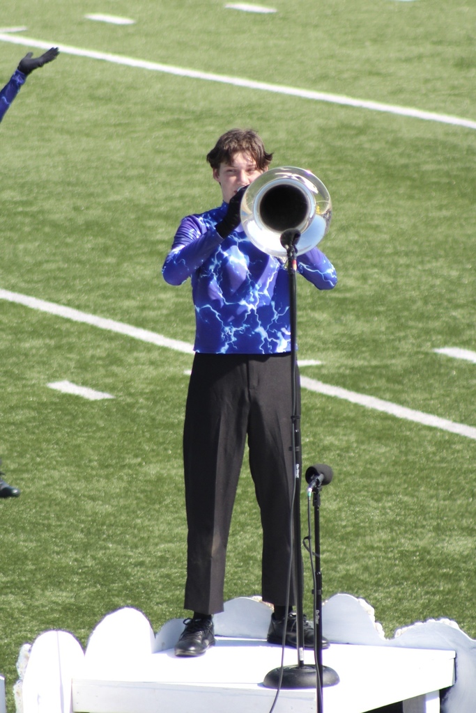 Student playing a solo during the marching show