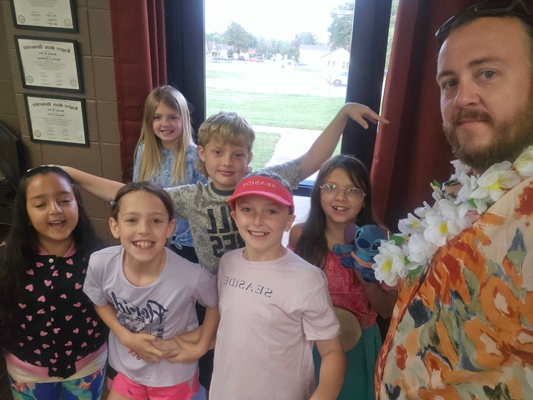 staff and students dressed in Hawaiian gear