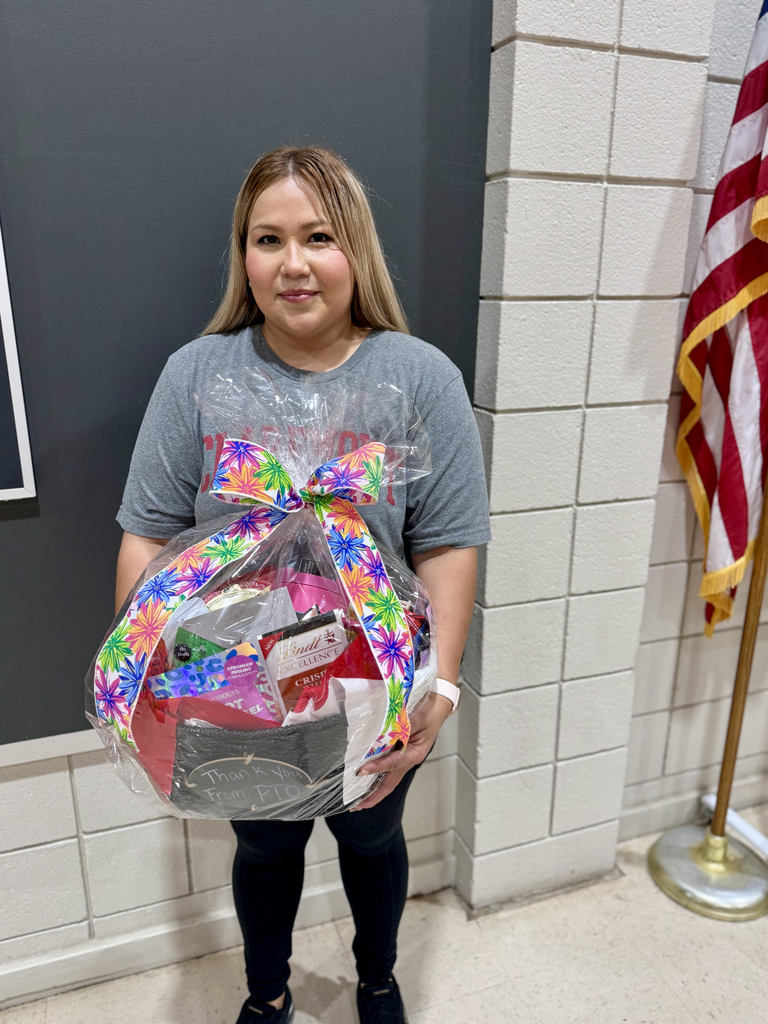 Custodian rubi holding a gift basket