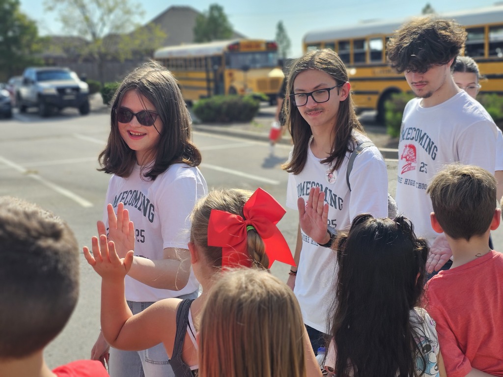 Fine Arts students greeting elementary students.
