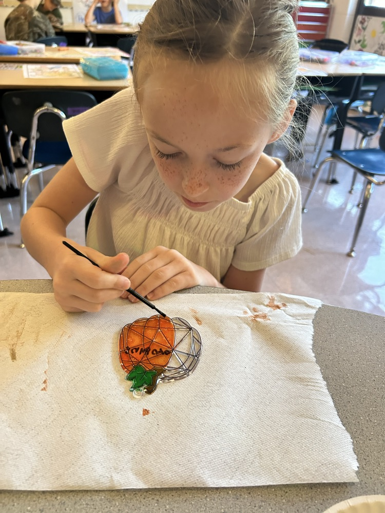 student learning about pumpkins