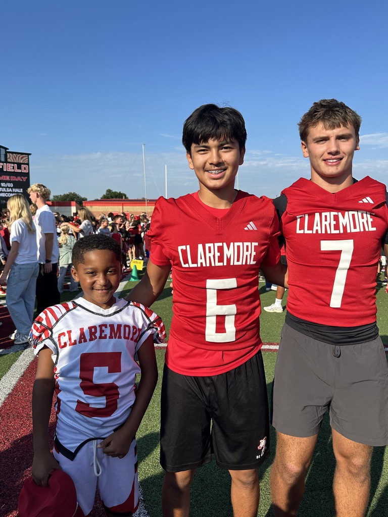 Student with football players