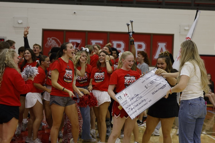 junior class getting check for winning