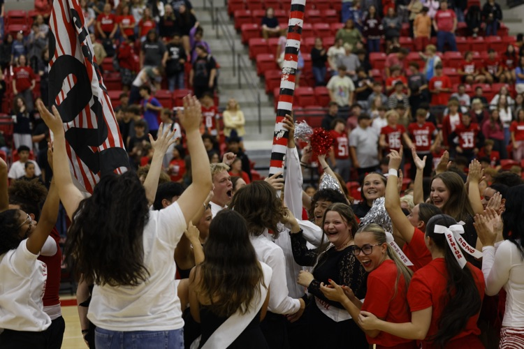 senior class celebrating the spirit stick