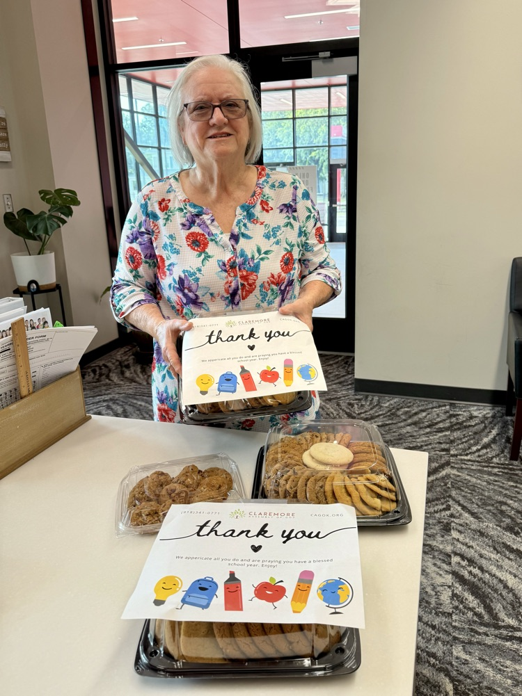 community leader with cookies she dropped off with staff