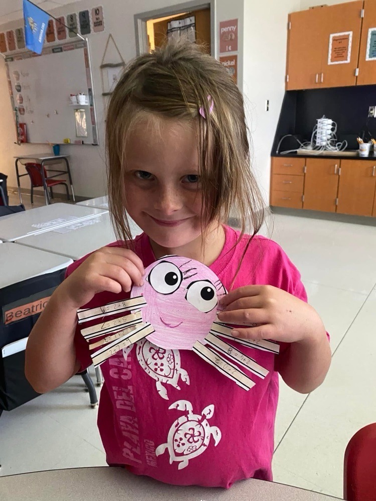 students with their spider crafts