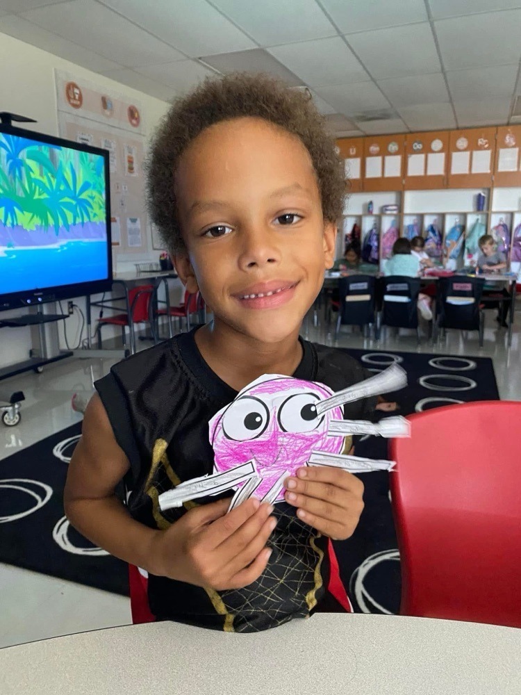 students with their spider crafts
