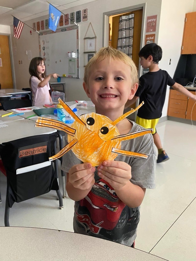 students with their spider crafts