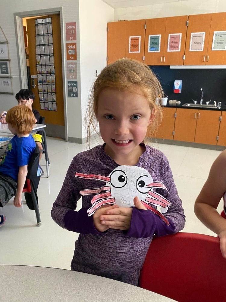 students with their spider crafts