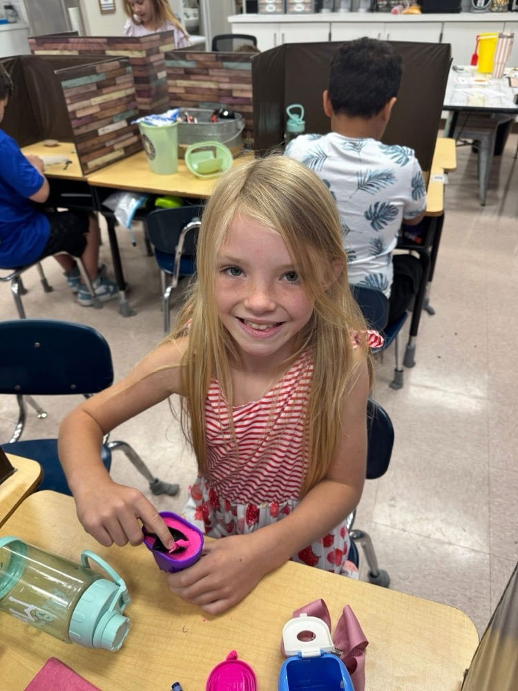 student playing with kinetic sand