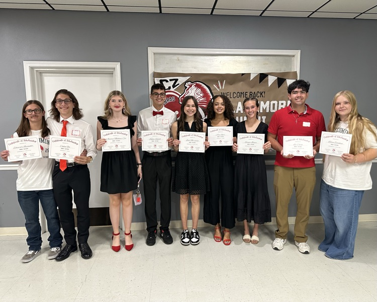 nine kids holding award