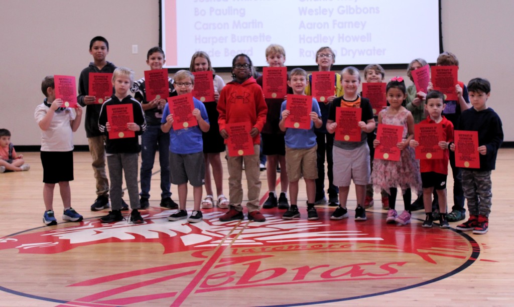 September Students of the moth holding their signs