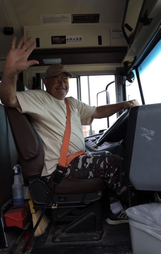 guy bus driver waving