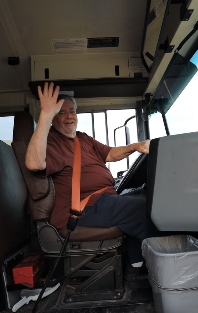 guy bus driver waving