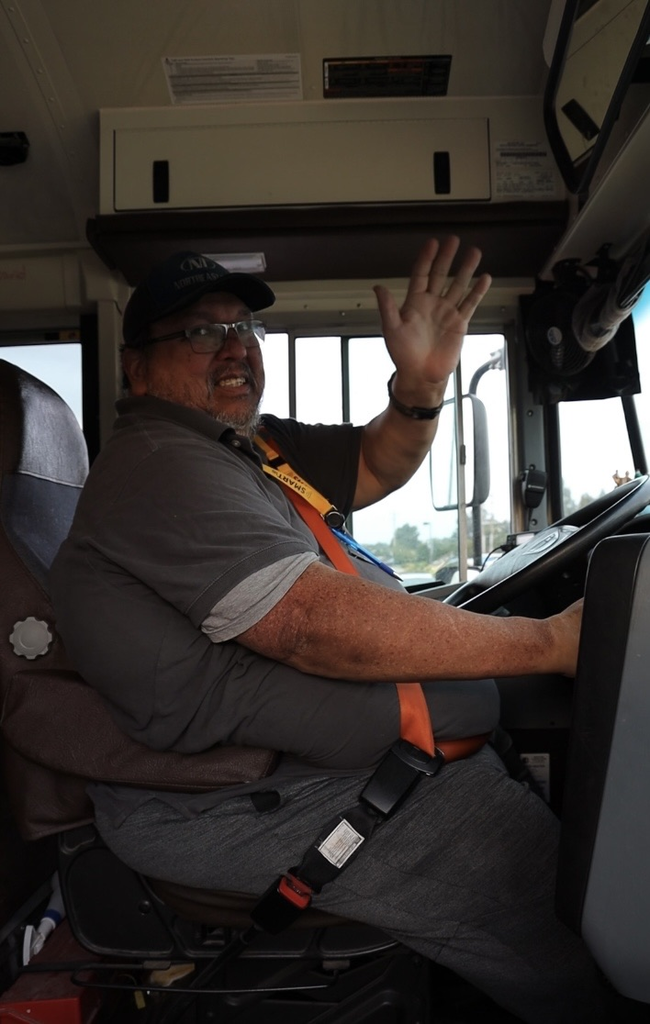 guy bus driver waving