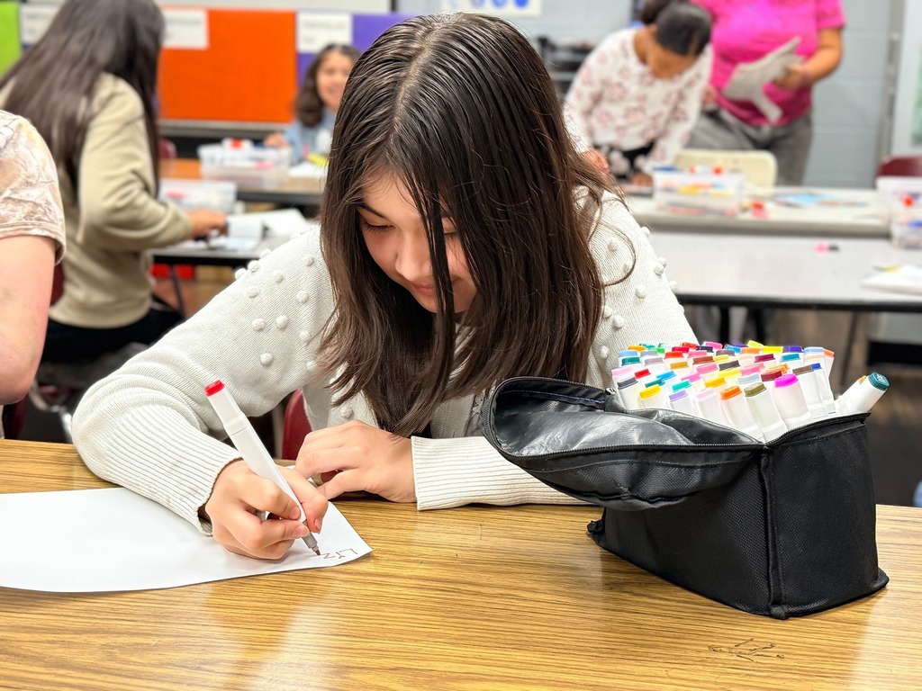 students working on their collages