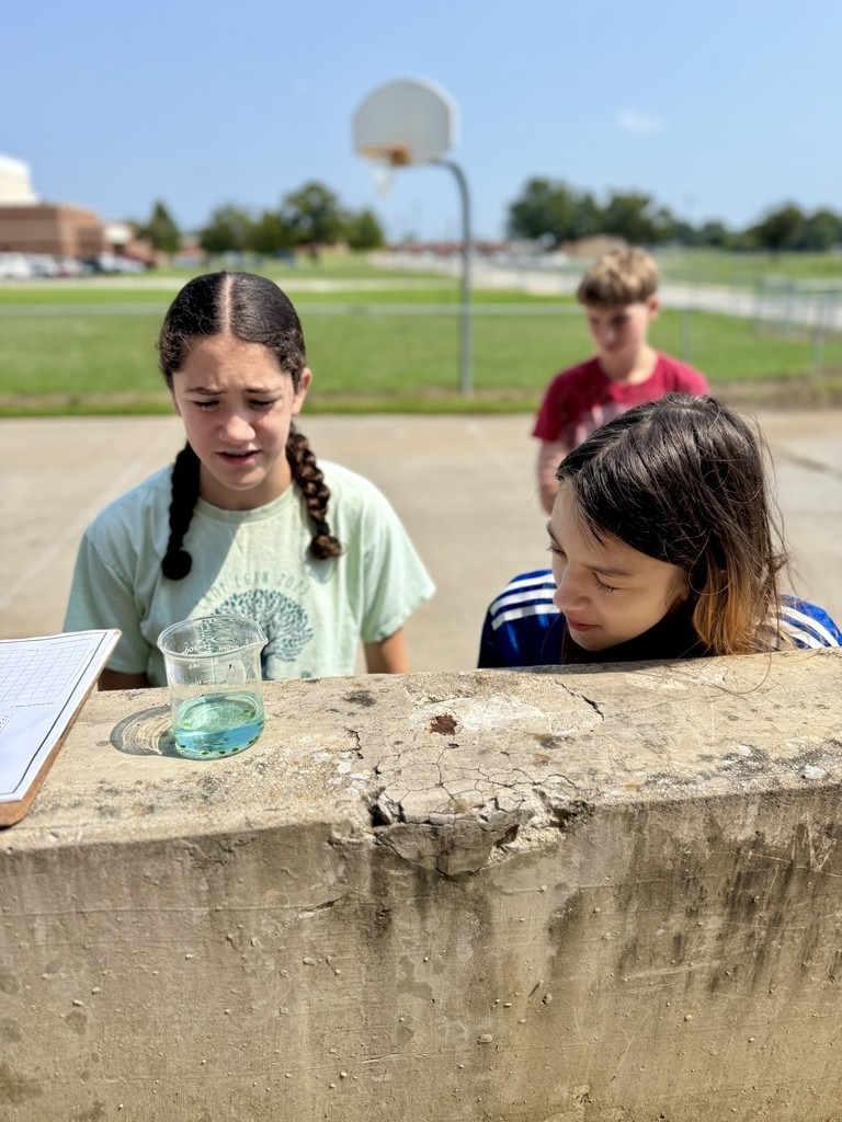 junior high students doing science