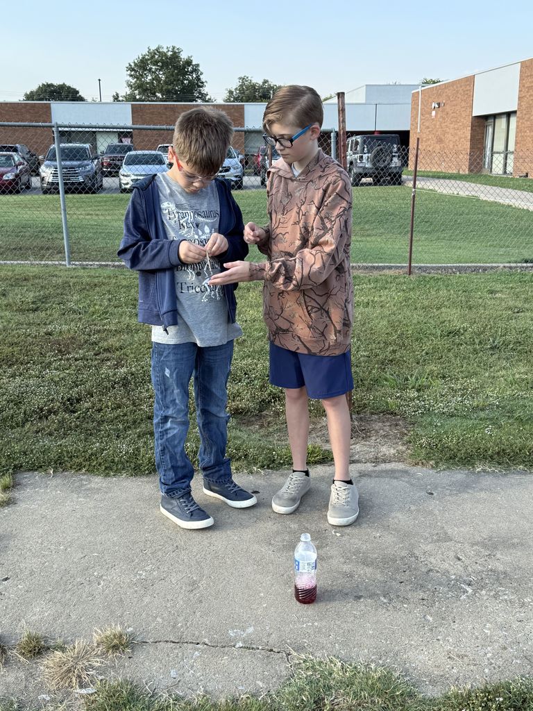 Students smiling with elephant toothpaste