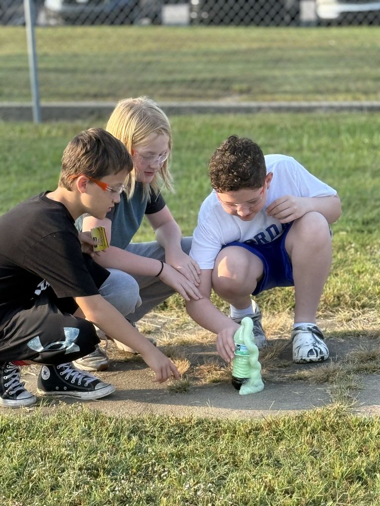 Students smiling with elephant toothpaste