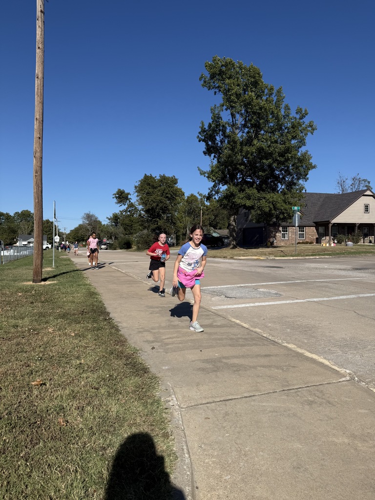 students running during running club