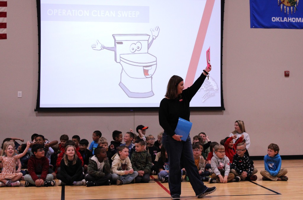 Brogan holding up an award