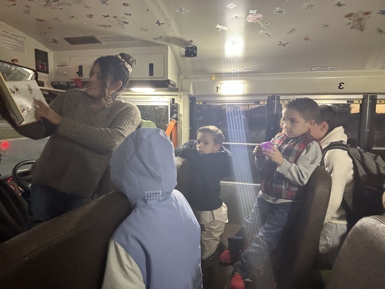 Miss Hartley reading to students