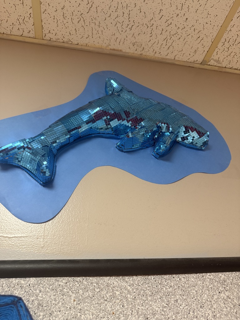 Our art classes are adding a little extra sparkle to the hallways! From glittering disco sharks to other dazzling animal creations, students are combining creativity, craftsmanship, and shine to bring their artwork to life. These “disco animals” light up our school with color, reflection, and personality — proving that art can make any space brighter!