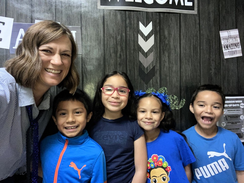 teacher with students smiling