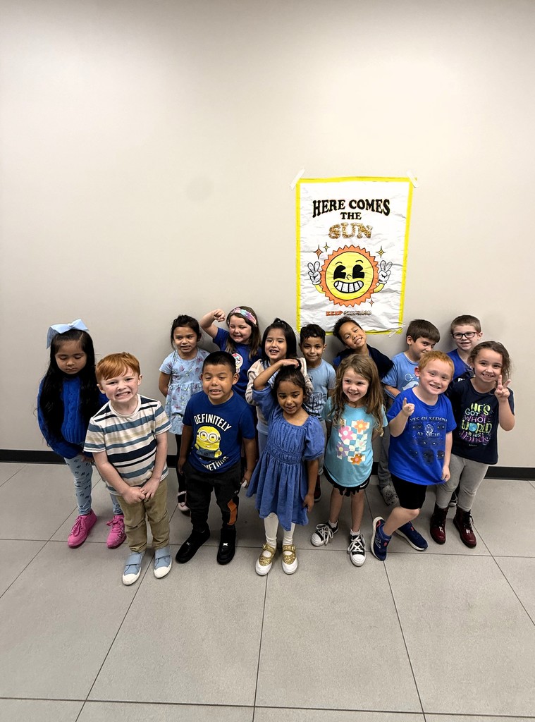 students smiling wearing blue