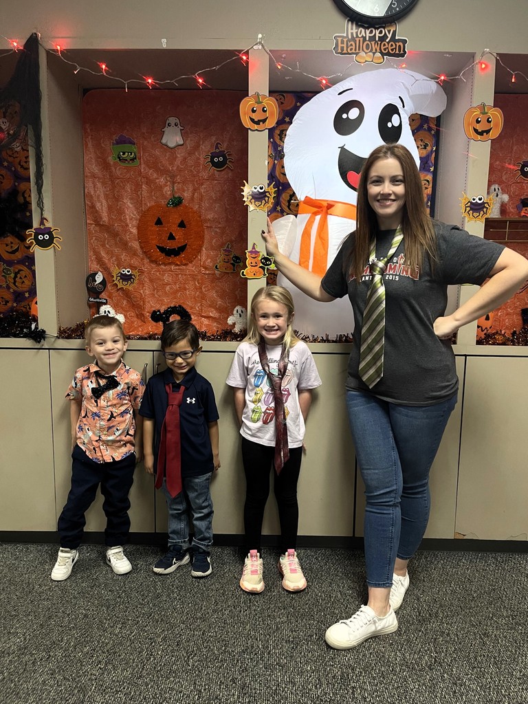 students wearing a tie with teacher